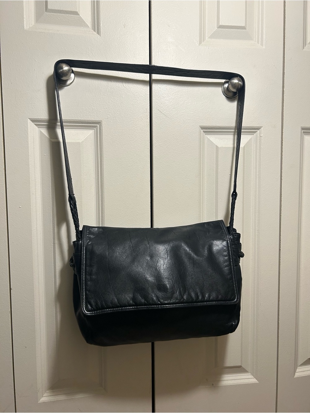 vintage Bottega Veneta black smooth leather flap crossbody bag.